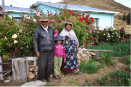 One of Santiago de Okola’s host family, in front of their house and garden.