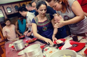 Members of the "Sisterhood of Survivors" in Kathmandu, Nepal, where they welcome travelers on G Adventures tours with a traditional lunch and dumpling making class. © G Adventures, Inc.